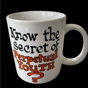 White Mug with Black and Orange Text